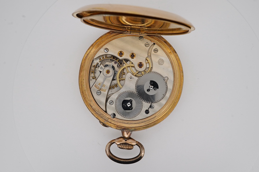 An engine turned gilt metal IWC open faced keyless dress pocket watch, with Arabic dial and subsidiary seconds, case diameter 51mm. Condition - fair to good